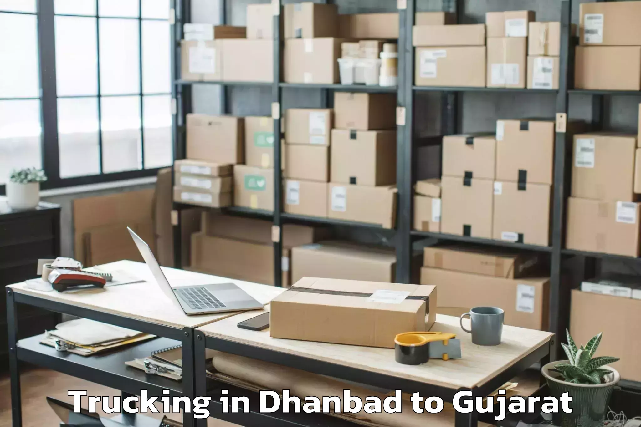 Discover Dhanbad to Upleta Trucking